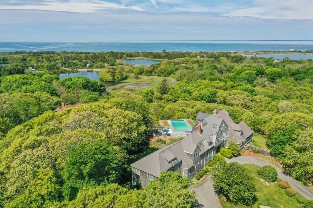 Aerial photograph of a home with a pool in West Falmouth, MA
