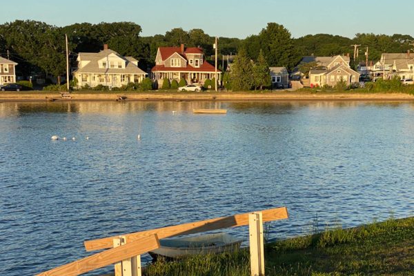 Photograph of a body of water in Onset with homes in the background